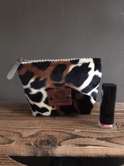 Make-up tasje met ritsje van bontachtige dierenprint