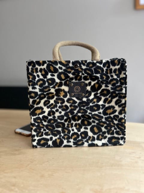 Handtas bekleed met beige panterprint