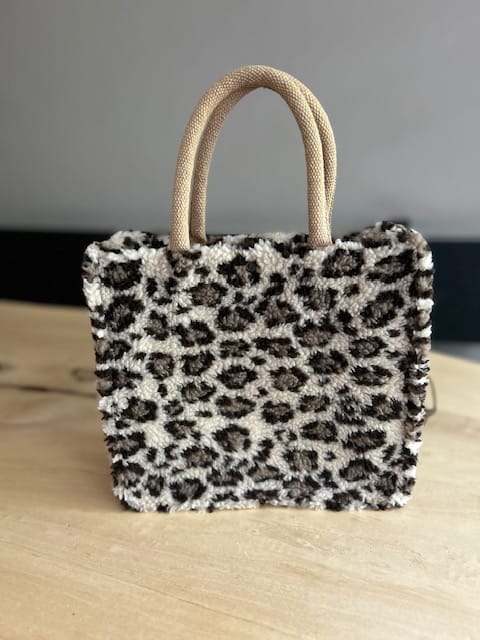 Handtas bekleed met beige teddy panter